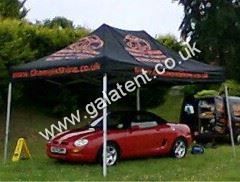 Gazebo being used for shelter for car while being valeted