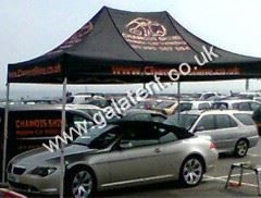 Gazebo being used for shelter for car while being valeted