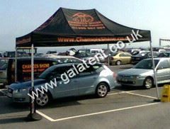 Gazebo being used for shelter for car while being valeted