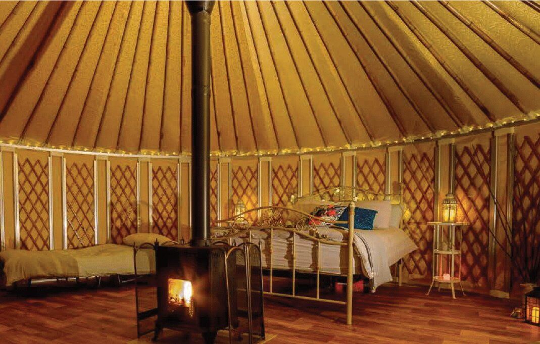 A cosy decked out glamping yurt