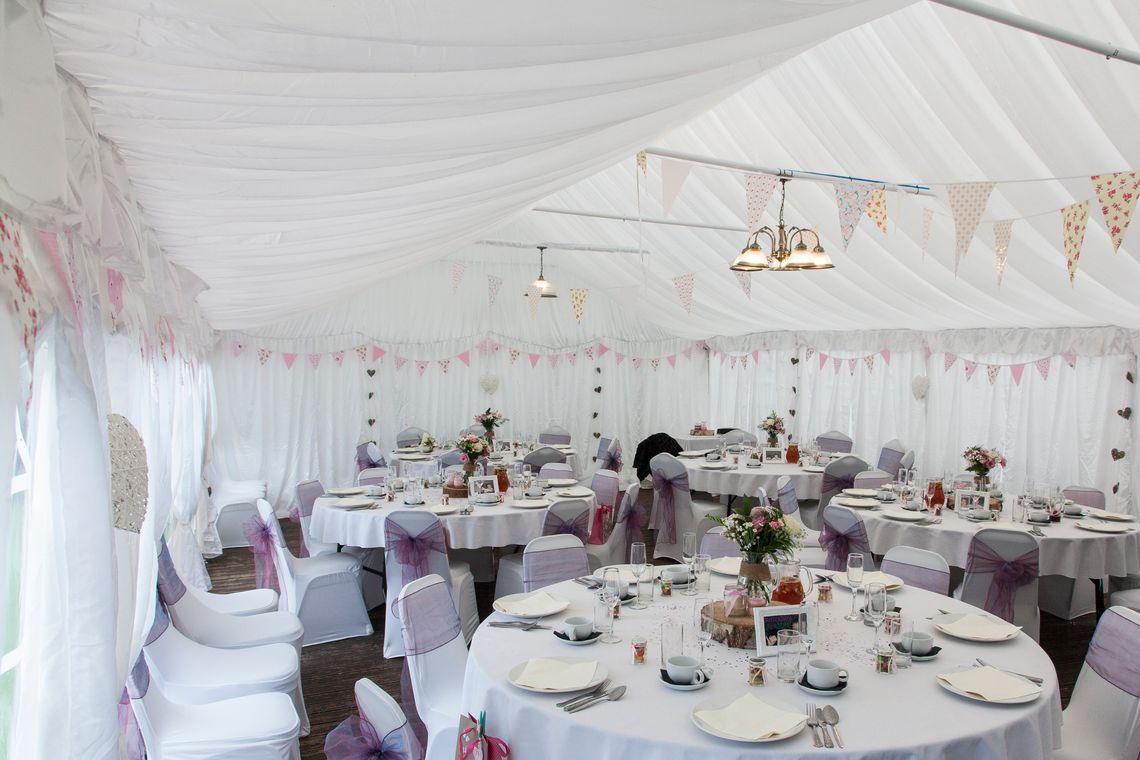 A marquee is decorated ready for a wedding