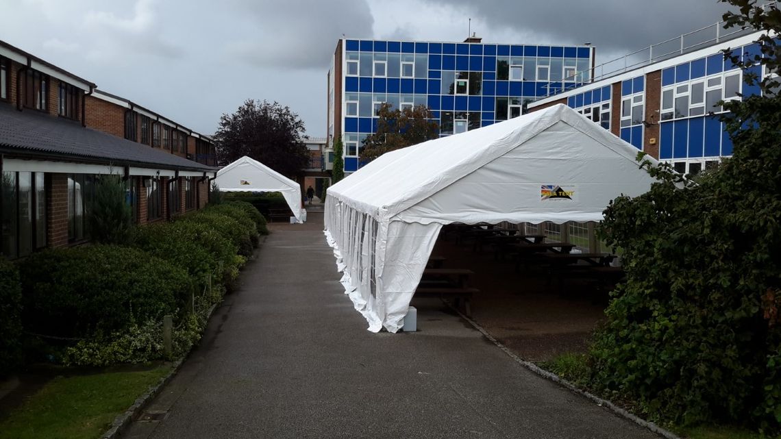 Two marquees sit in a school ground, helping to protect children during the RAAC crisis