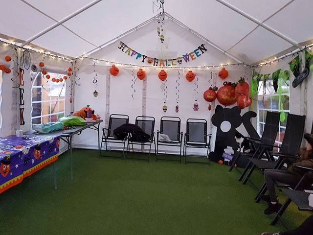 A marquee that's been decorated for a Halloween party