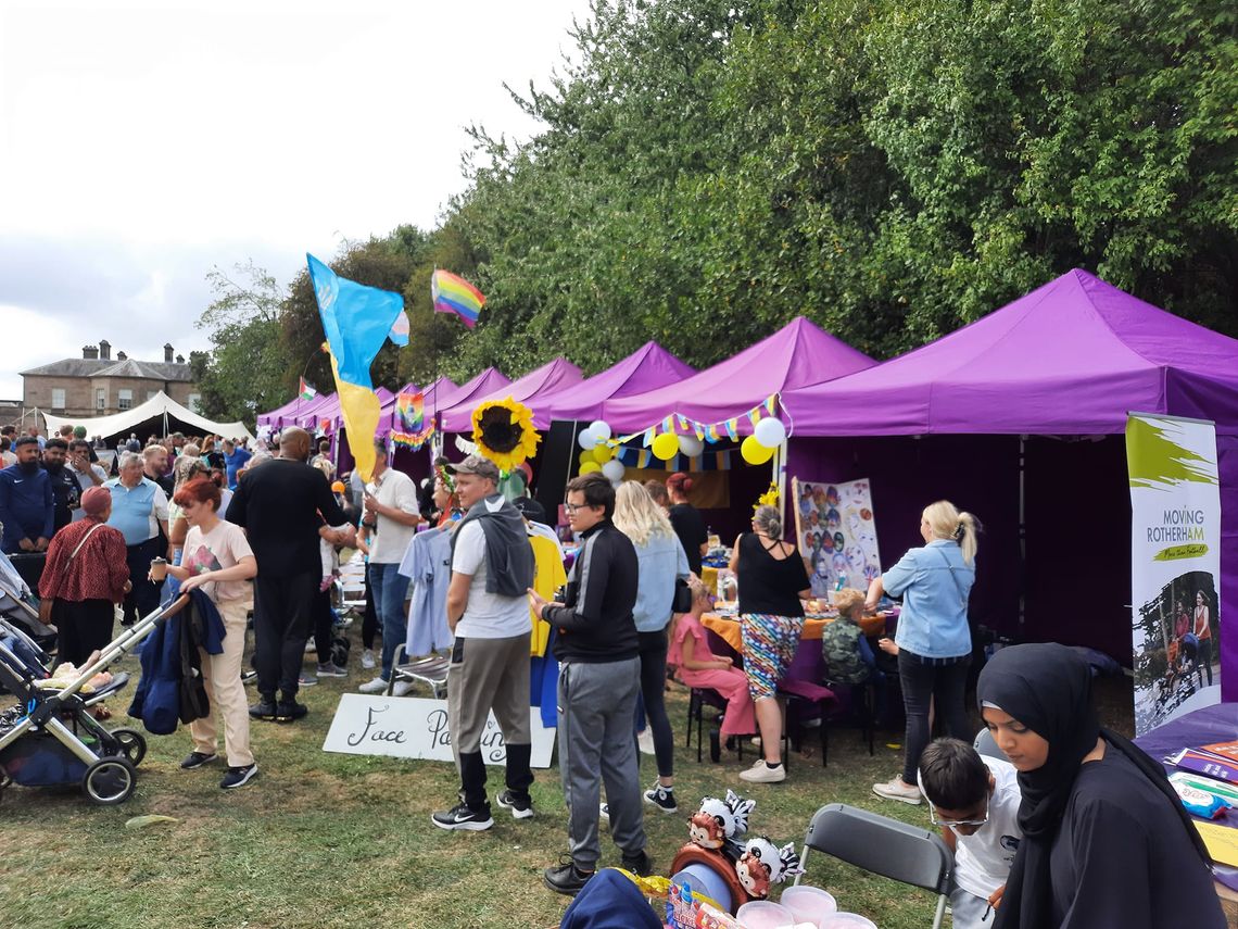 Purple gazebos at a town festival