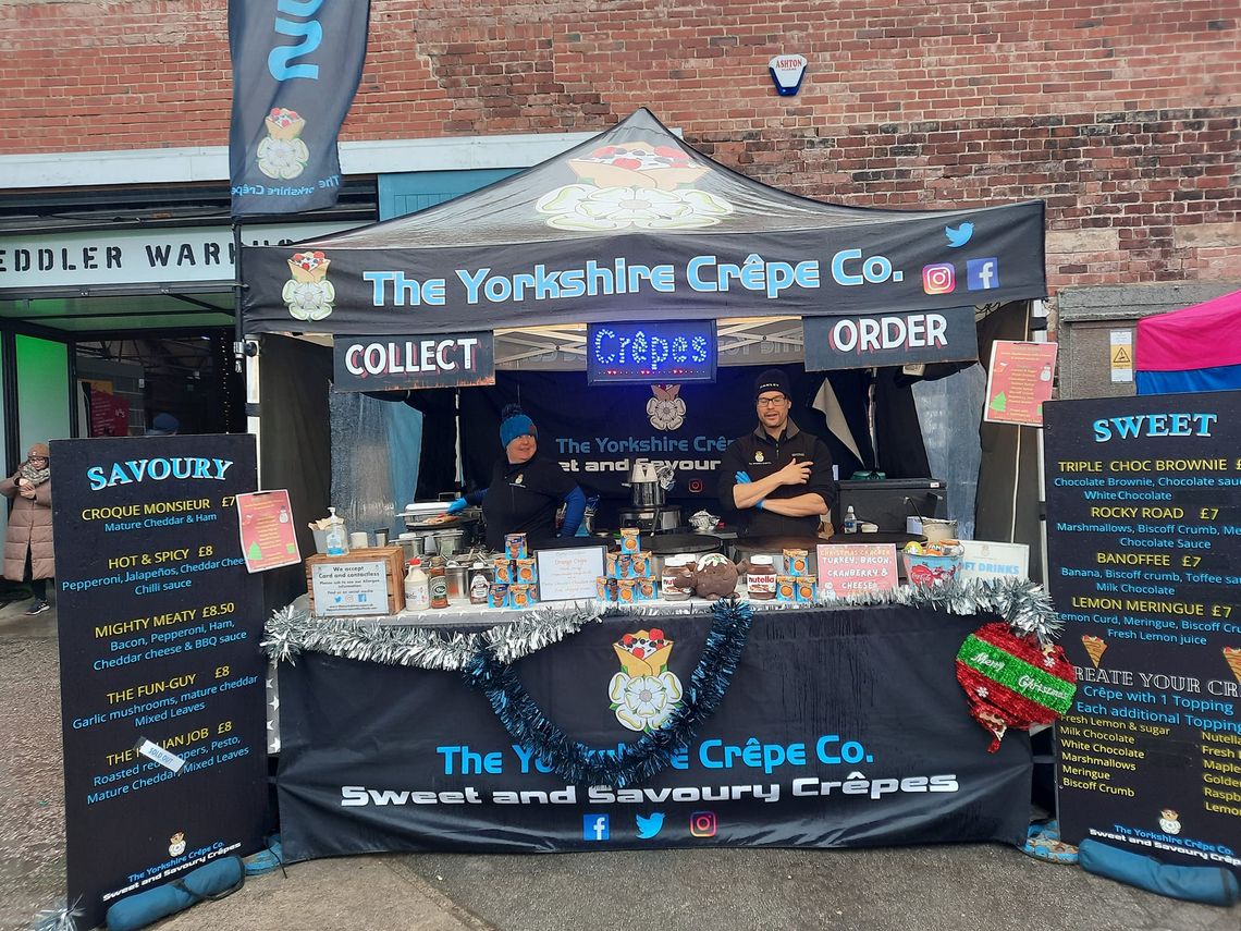 A printed black pop up gazebo used by a crepe maker from Yorkshire