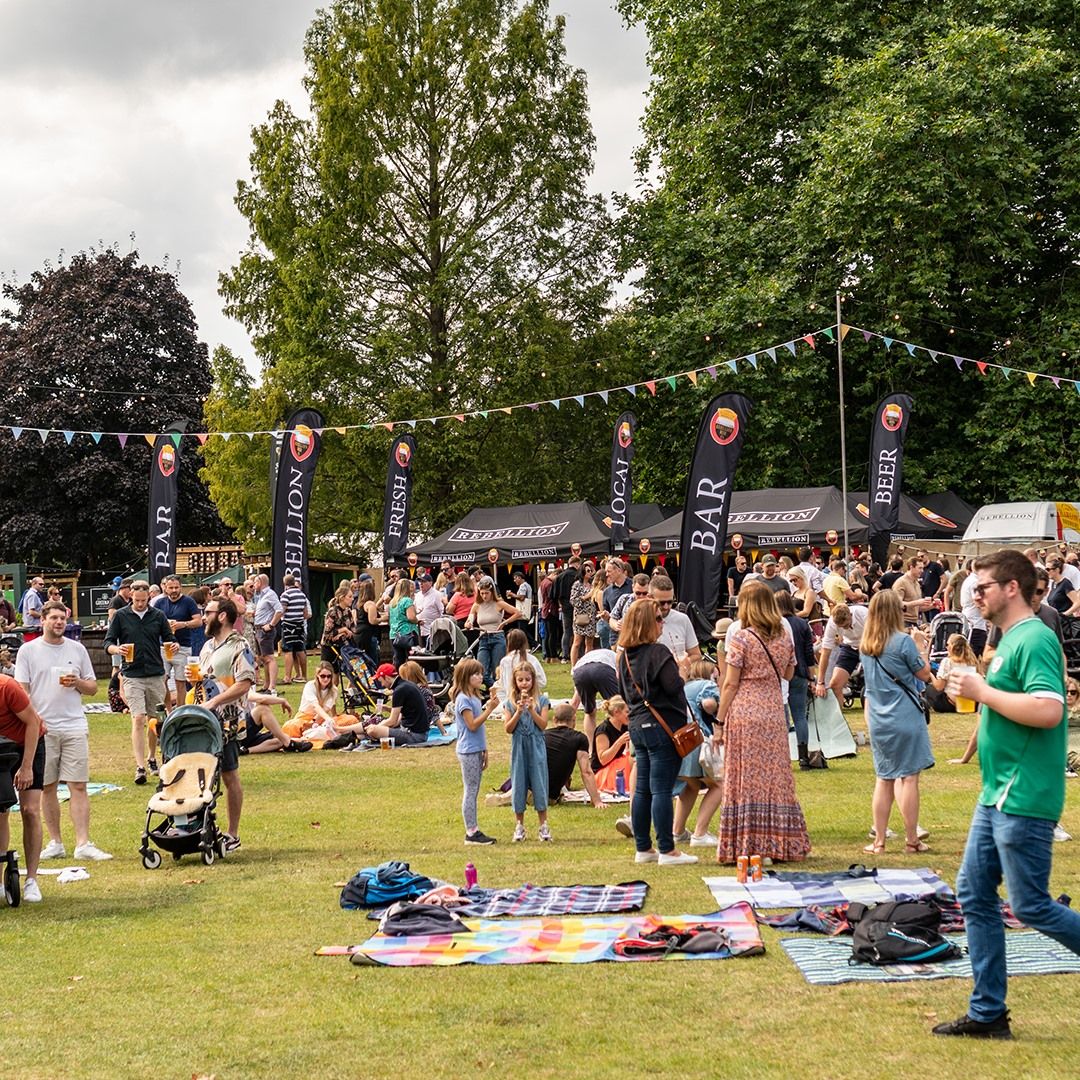 Several popup gazebos used as mobile bars for Rebellion Brewery