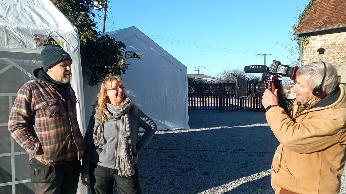 A screenshot of a Gala Tent marquee in the background of a TV show