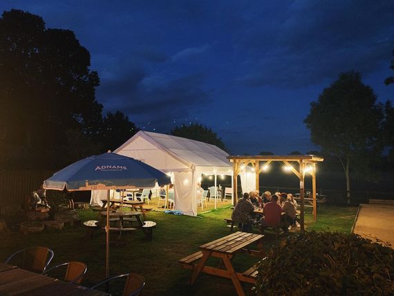 Marquee in a pub garden at night