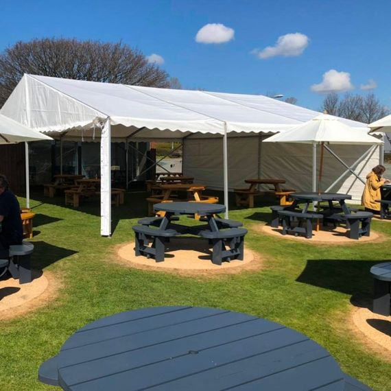 A marquee providing shelter in a pub beer garden