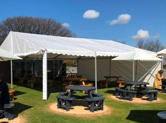 A marquee providing shelter in a pub beer garden