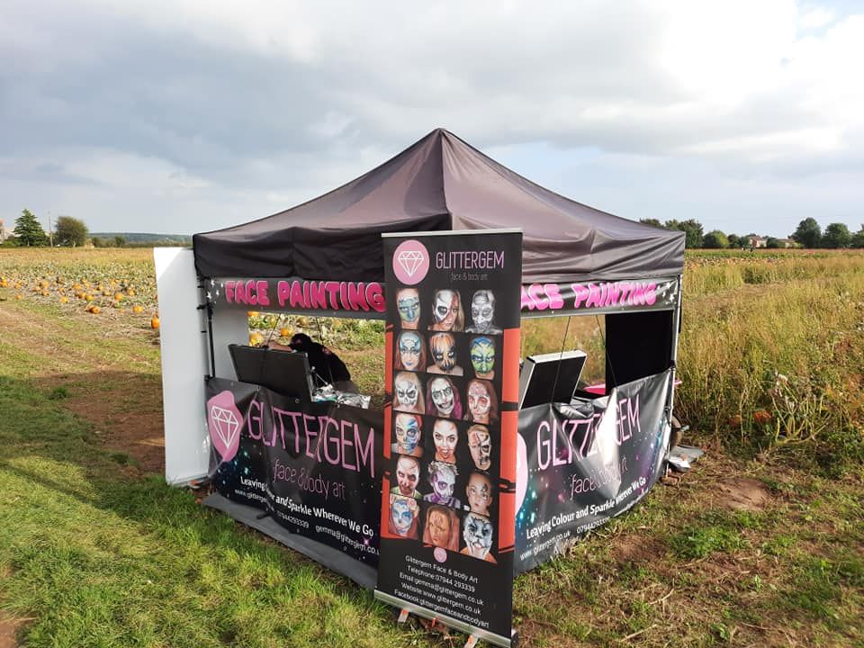 A facepainting stall using a waterproof gazebo