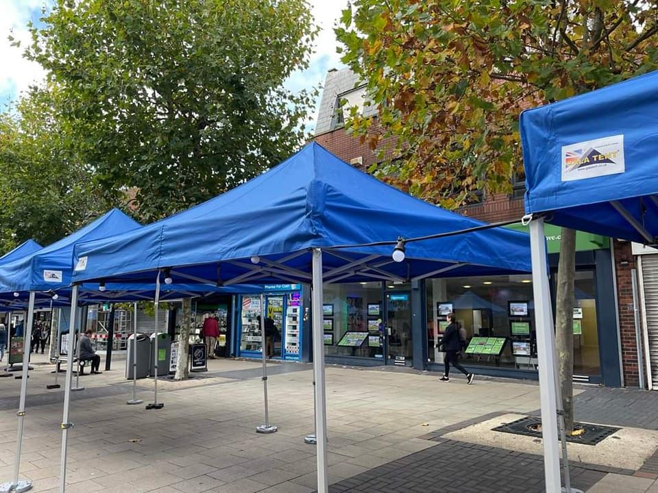 A series of blue waterproof gazebos in Bexleyheath