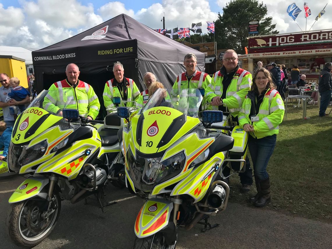 Cornwall blood bikes with motorcycles standing in front of a printed gazebo
