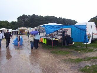 A broken market stall on a rainy day