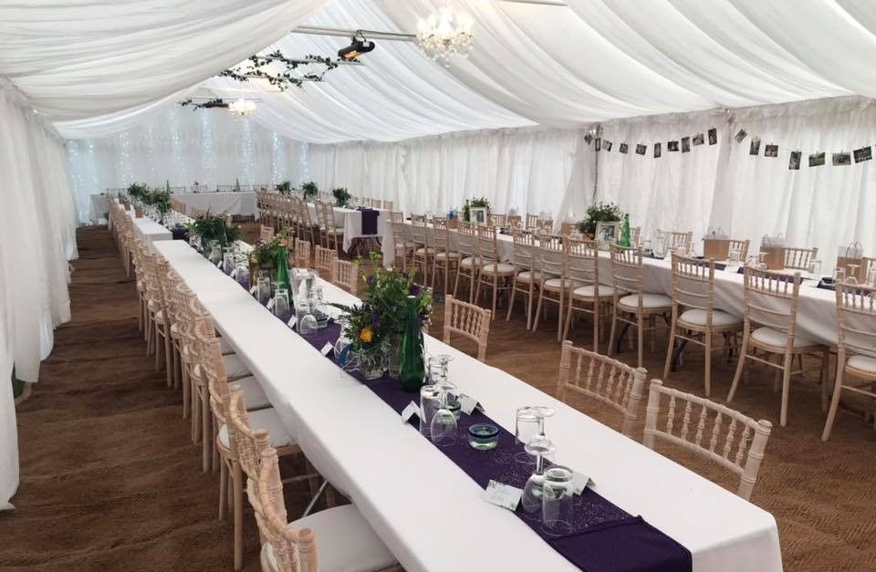 Gala Tent Marquee decorated with tables, chairs and accessories for a wedding