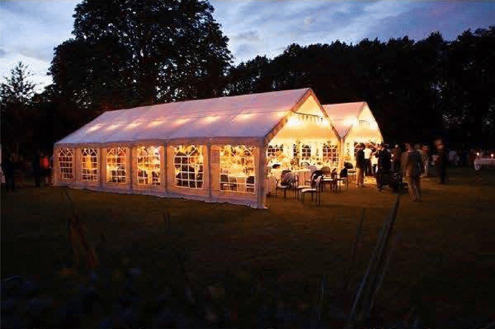 Gala Tent Marquee decorated with tables, chairs and accessories for a wedding