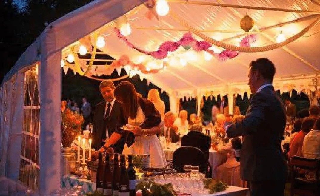 Gala Tent Marquee decorated with tables, chairs and accessories for a wedding