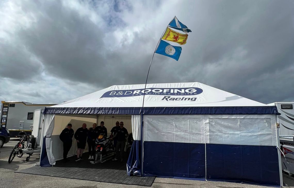 freestanding MQ-65 motorsport awning with printed roof and sidewalls
