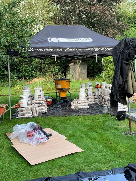 A printed pop up over a work space in a garden