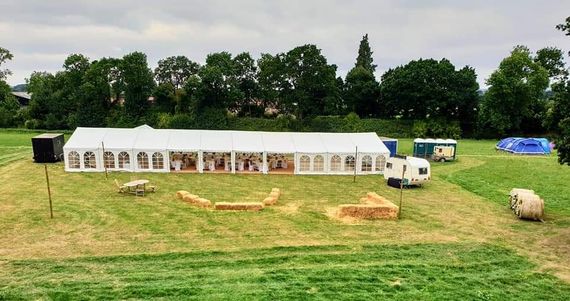 big hire marquee wedding 2 A long shot photograph of a large wedding marquee