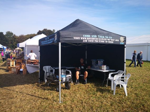 black charity gazebo printed A custom printed business gazebo set up outside