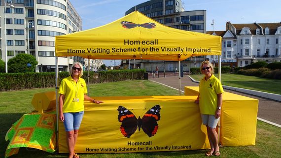bright yellow charity gazebo A custom printed business gazebo set up outside