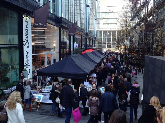 Black gazebos being used as stalls at the Southbank markets