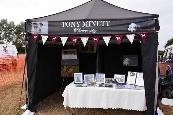 A black gazebo being used as market stall