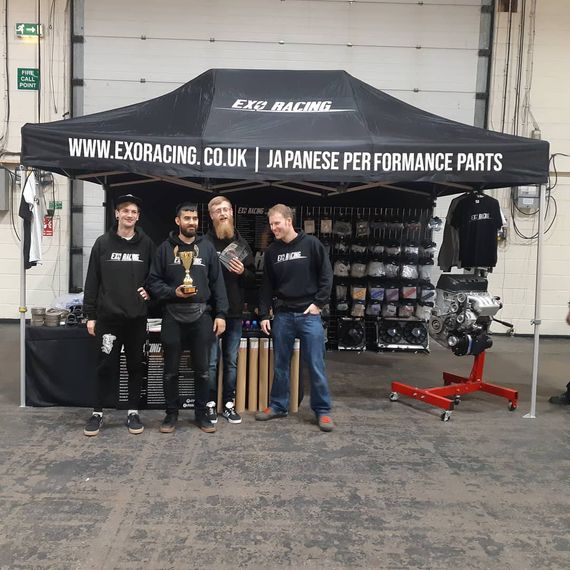 Branded black gazebo selling racing merchandise
