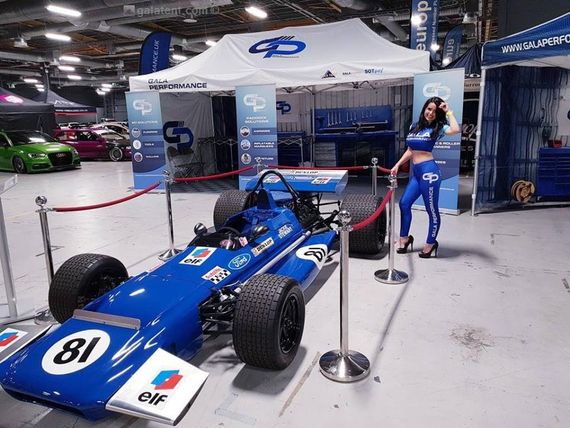 Gala Performance branded gazebo housing tools, positioned behind a race car