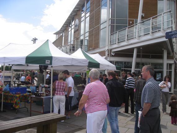 A street market with gazebos used as shelters for stalls