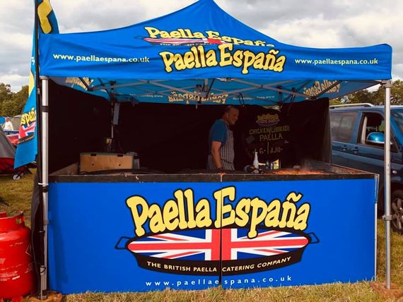 bright blue paella gazebo A gazebo with custom printed branding for a catering vendor