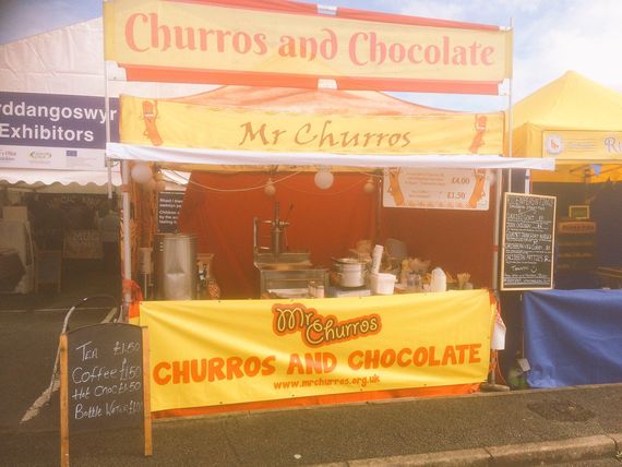 yellow churros gazebo with banner