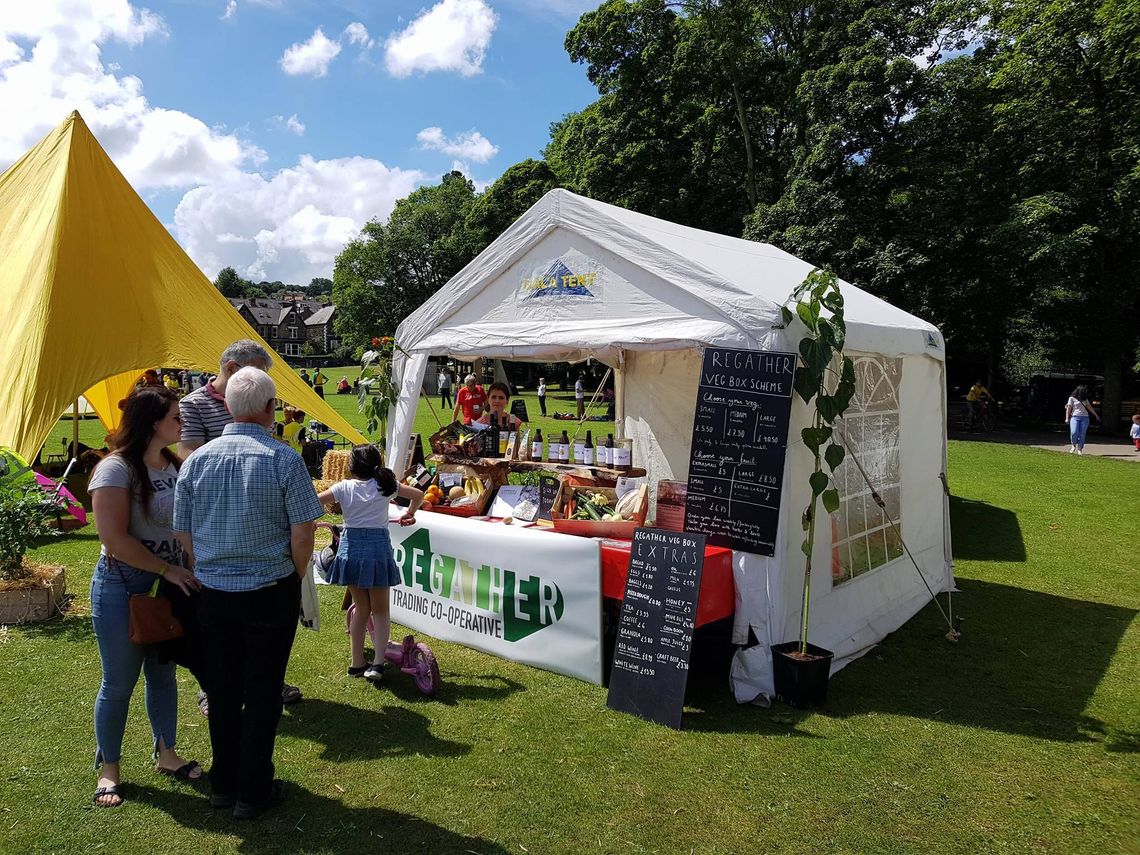 A small marquee at a park festival