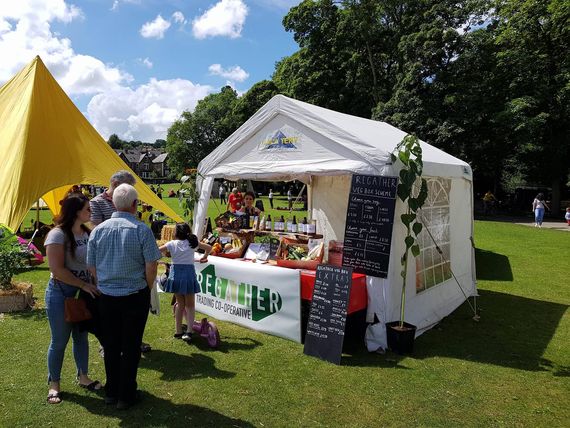 A small marquee at a park festival