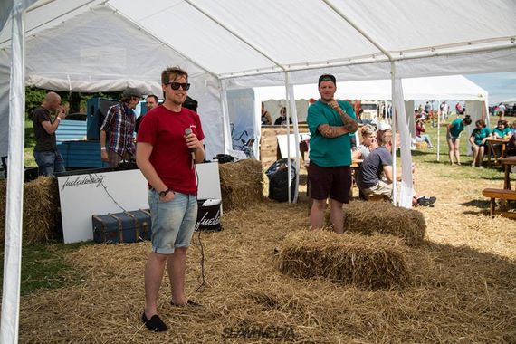 A marquee providing shelter at a summer festival