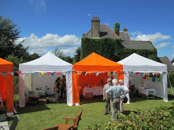 Orange and whites gazebo at a summer fete
