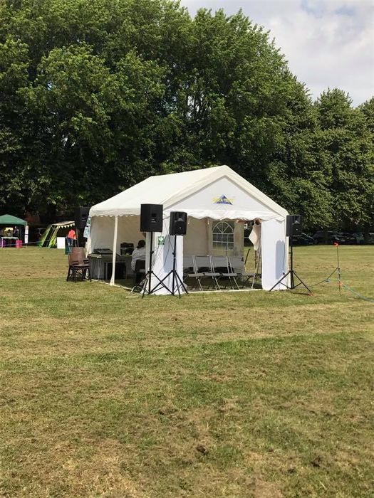 A marquee sheltering a performer at the tramlines folk festival