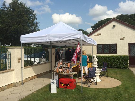White gazebo outdoors at a summer fete