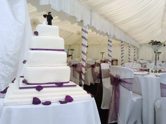 Gala Tent Marquee wedding with wedding cake in the foreground