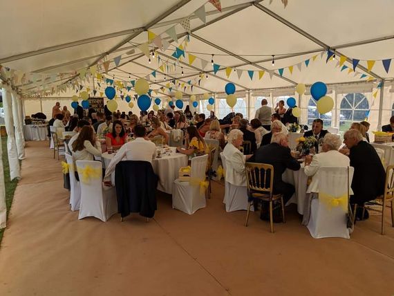 Gala Tent Marquee decorated for a wedding with attendees seated at tables