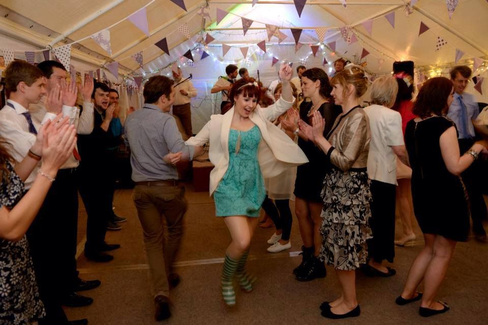 Gala Tent Marquee decorated for a wedding with attendees dancing