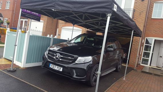 Gala Shade Pop Up Gazebo sheltering a car on a driveway
