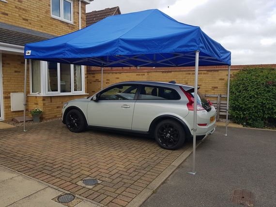 Gala Shade Pop Up Gazebo sheltering a car on a driveway