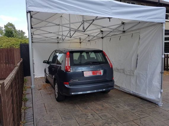 white vehicle shelter gazebo