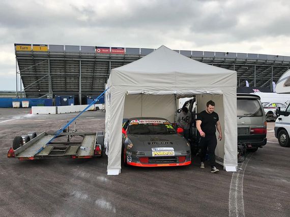 pop up motorsport tent 12 A white pop up gazebo providing shelter on a rainy track day
