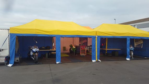 pop up motorsport tent 19 A pair of linked Pop Up Motorsport Tents at an outdoor motorsports event