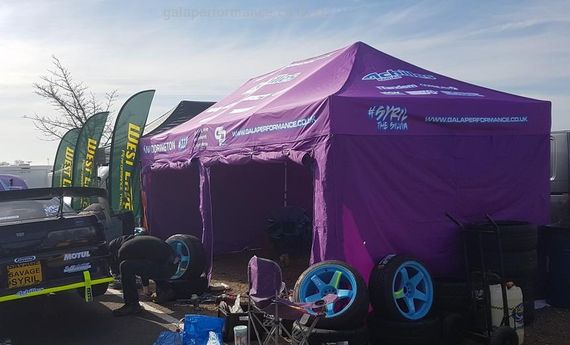 purple printed drift paddock tent Gala Performance branded Pop Up Motorsport Tent at an outdoor motorsports event