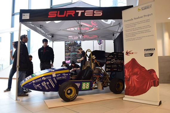 pop up motorsport tent 8 A printed gazebo with a company logo at an indoor motorsport event