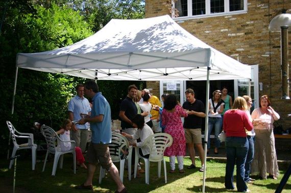 A white 3m x 4.5m Gala Shade Gazebo in white in someone's garden